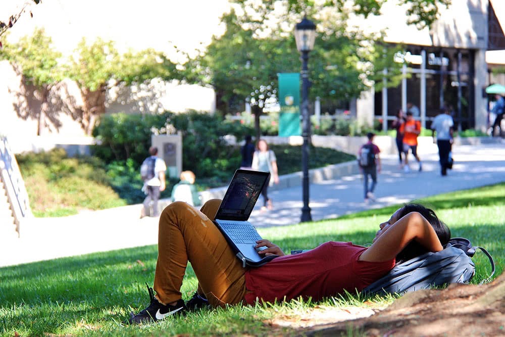 Student relaxing on the Quad